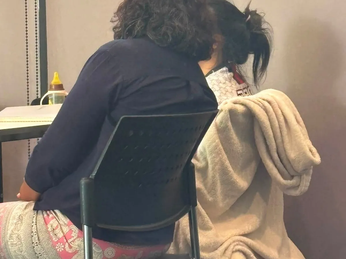 Two Wellspring participants praying together