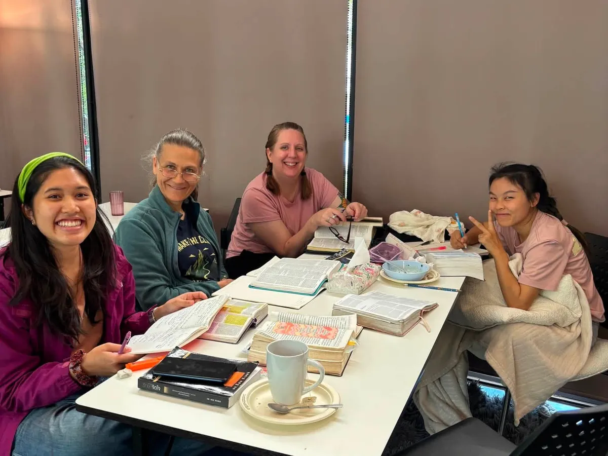 Wellspring students studying Scripture together at a table