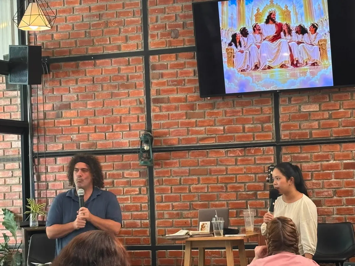 Teaching session at The Wellspring in front of the brick wall at The Seed